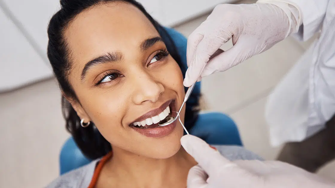 Smiling Woman in Dental Chair